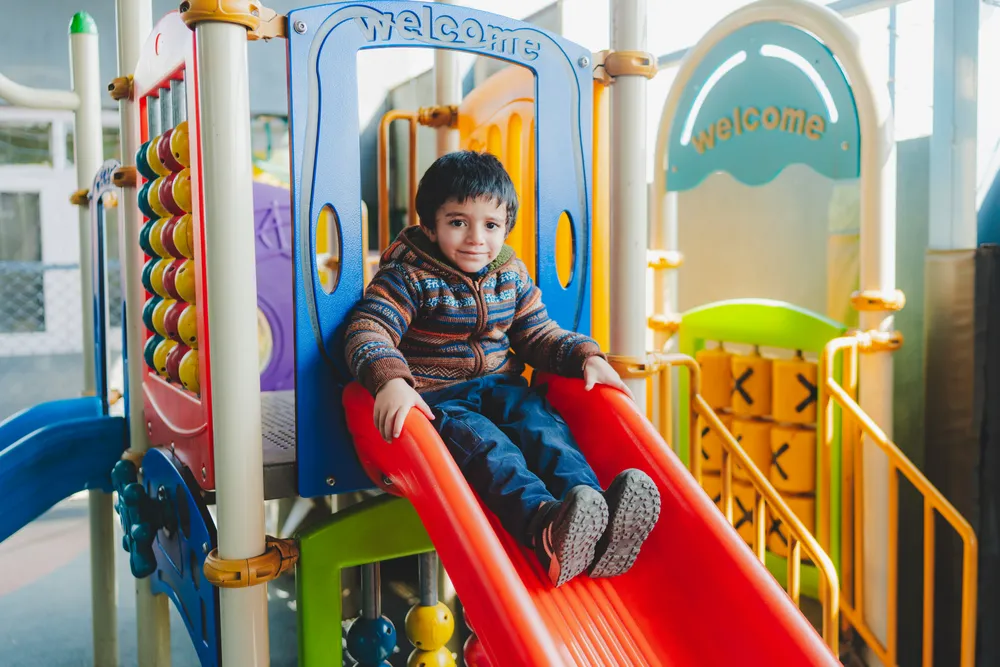 A child playing on the slide